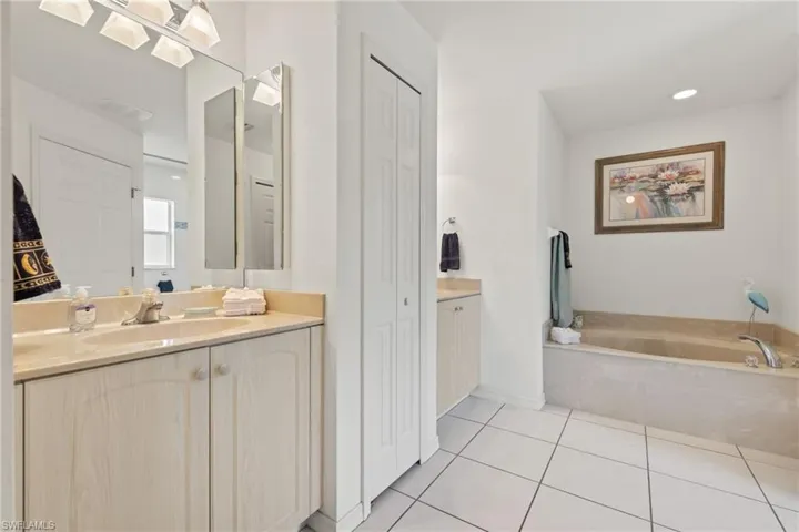 Primary bathroom with garden tub and separate walk in shower
