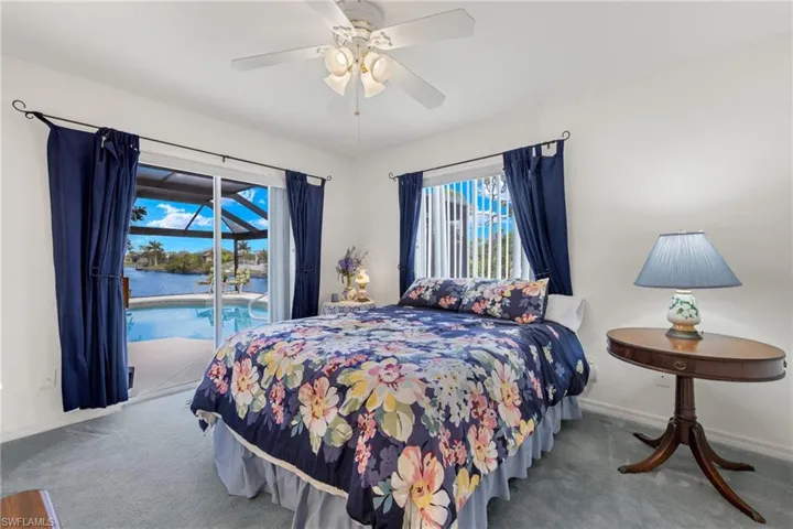 Bedroom 2 with sliders out to pool