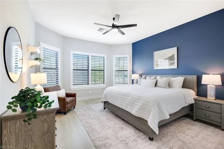 Bedroom featuring light wood finished floors and a ceiling fan