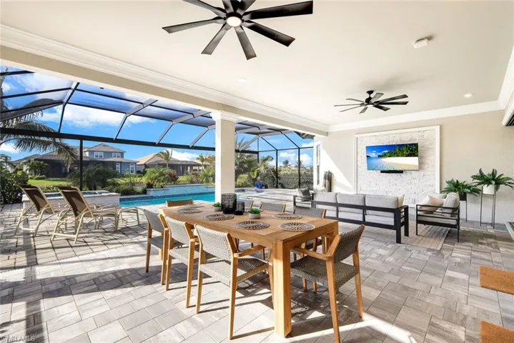 View of patio / terrace with a sunroom, a ceiling fan, outdoor lounge area, outdoor dining space, and a lanai
