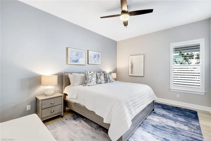 Bedroom featuring ceiling fan and light wood-style flooring