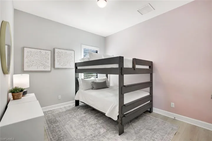 Bedroom featuring baseboards and light wood-style floors