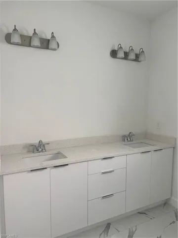 Bathroom with vanity and tile floors