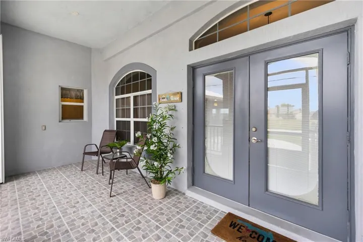 Doorway to property featuring french doors