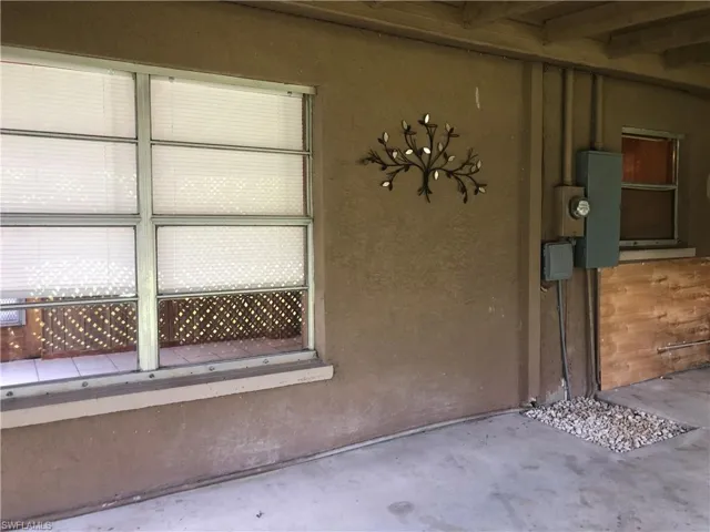 Rear enclosed porch / patio area