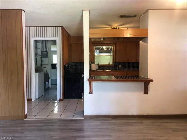 Living room showing wood-style flooring