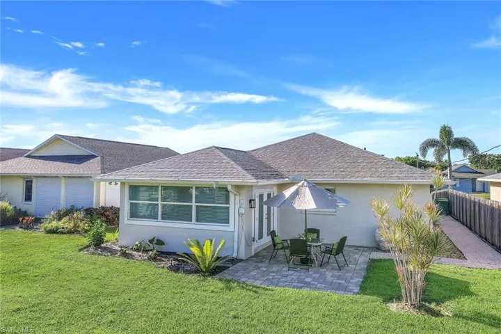 Single story home featuring a back yard and patio area. Plenty of room for a pool.