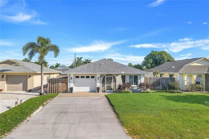 Ranch-style home on the 500 block of Naples Park. Upgrades include new roof, and impact windows.