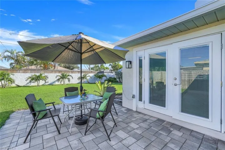 View of patio / terrace with beautiful lush large backyard. Plenty of room for a pool/spa.