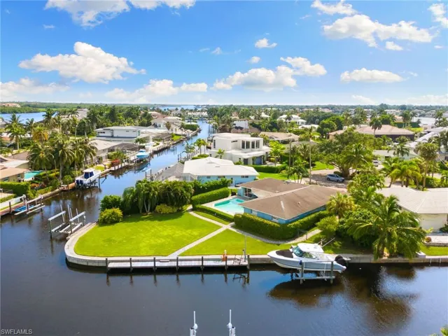 Huge .37 acre (16,155 sq ft) Tip Lot, 200' seawall with Remodeled Cottage and New Construction Drawings by Falcon Design!!!