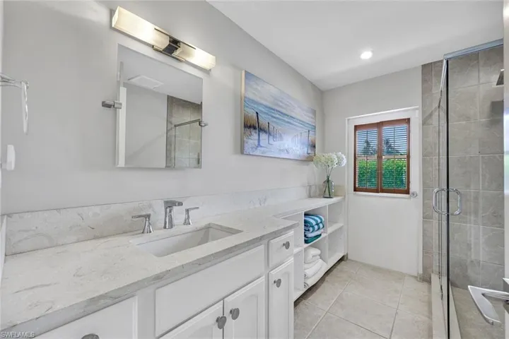 Pool Bath doubles as Powder Bath with Shower and Pool Towels that serves bedroom 4/study