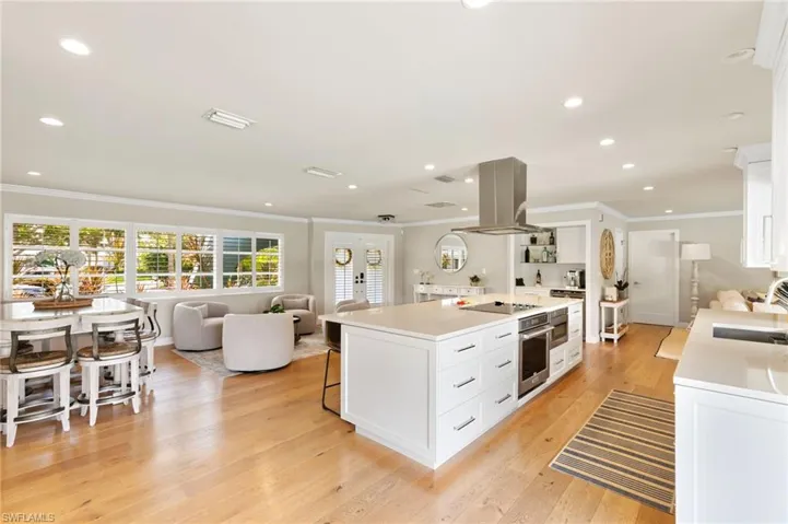 The Great Room offers a bright open kitchen with seating and dining with spacious family room connected.