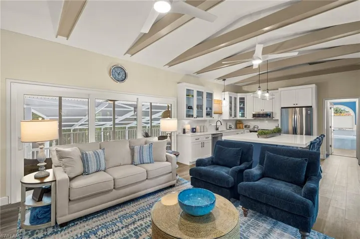 Living room with ceiling fan and wood finished floors