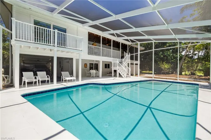 Swimming pool with stairs and a patio