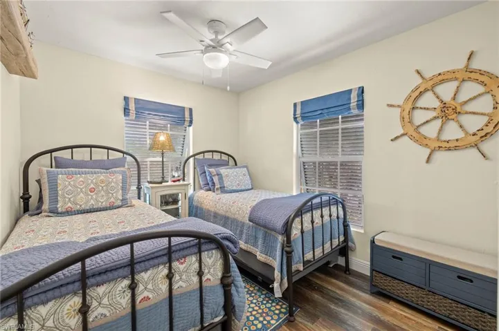 Bedroom featuring wood finished floors and ceiling fan