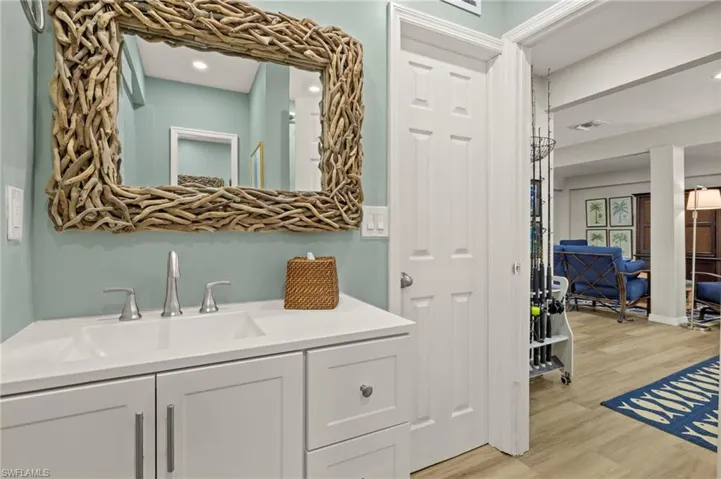 Bathroom featuring wood finished floors and vanity