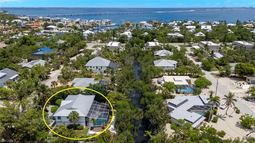Aerial perspective of suburban area with a large body of water