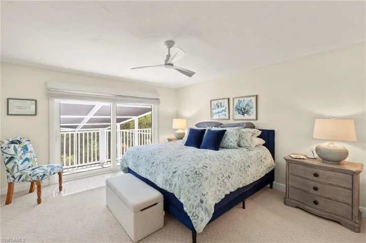 Bedroom with access to outside, carpet flooring, and ceiling fan