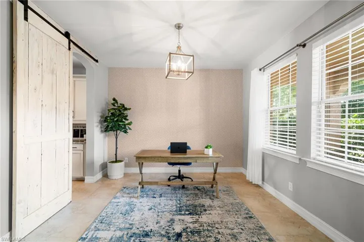 Tiled office space with a barn door