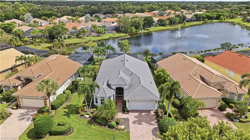 Gated community setting with a lake and fountain feature