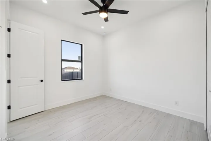 Empty room featuring light hardwood / wood-style floors and ceiling fan