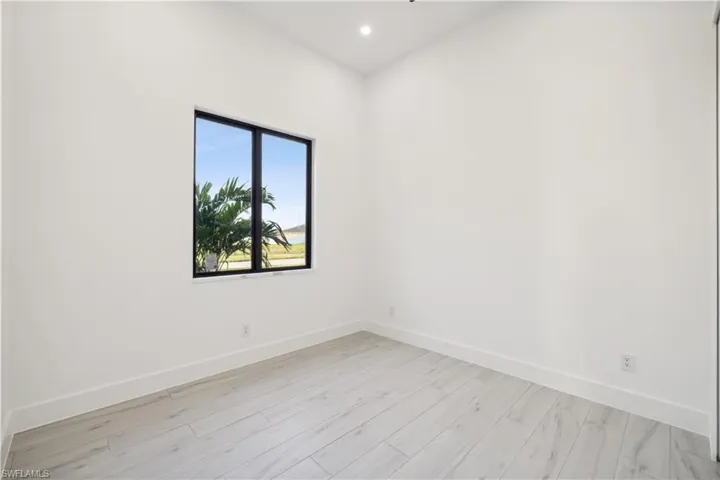 Spare room featuring light wood-type flooring