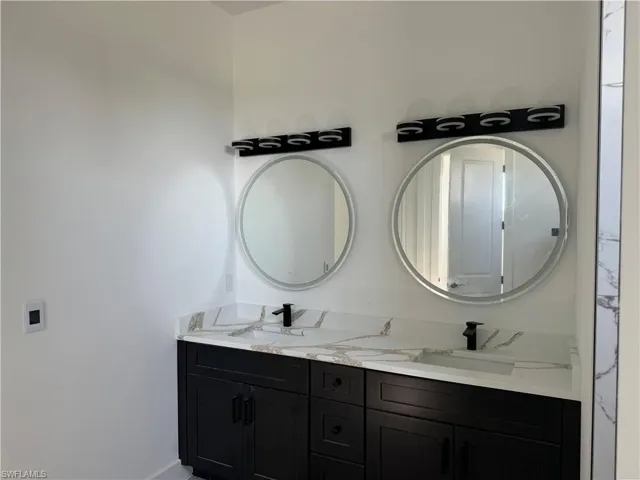 Bathroom featuring dual vanity