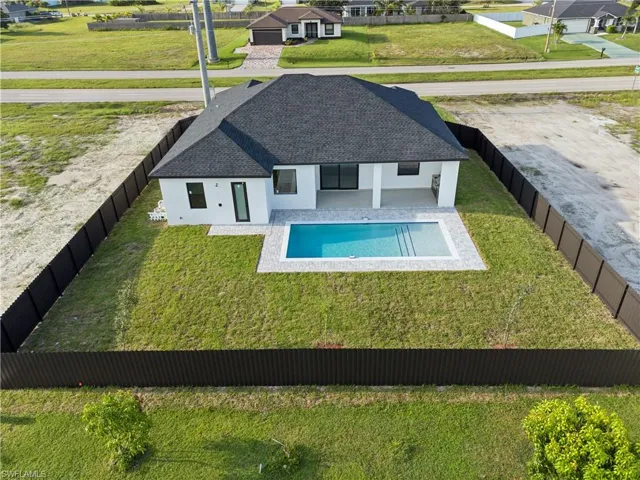 View of pool featuring a yard
