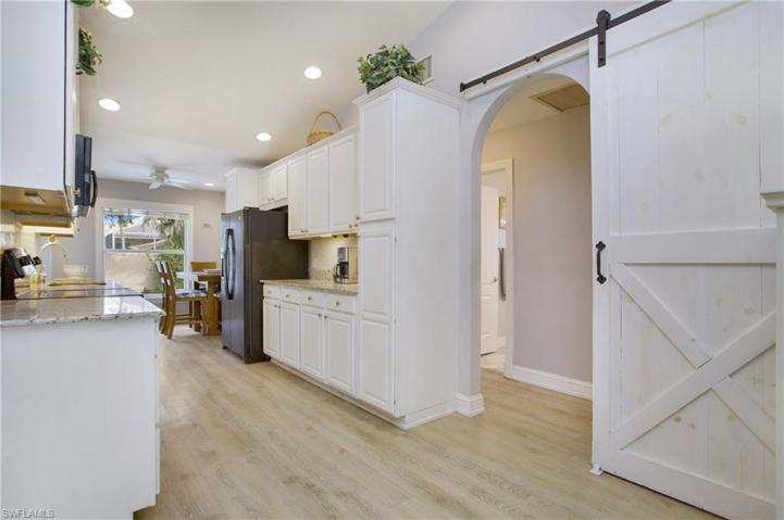 This hallway off of the kitchen leads to 2 guest bedrooms and full bath.