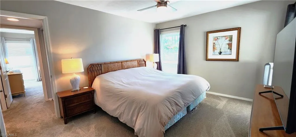 Bedroom with carpet flooring and ceiling fan