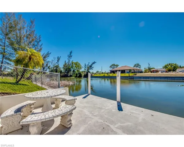 View of patio with a water view