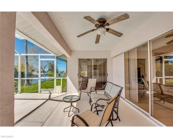 View of patio / terrace with a lanai and ceiling fan