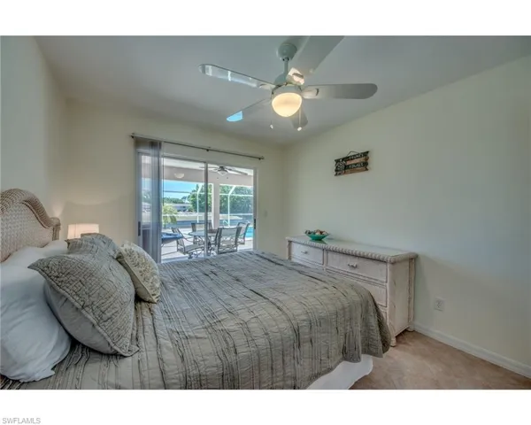 Bedroom featuring access to outside and ceiling fan