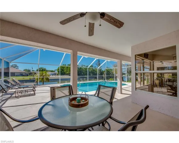 View of patio / terrace with ceiling fan and glass enclosure
