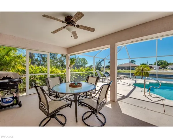 Sunroom featuring ceiling fan and a healthy amount of sunlight