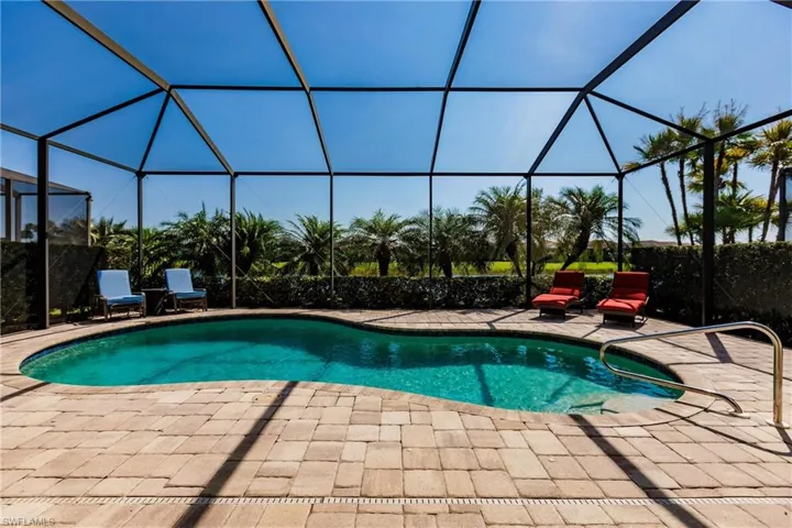 View of pool featuring a patio area and a lanai