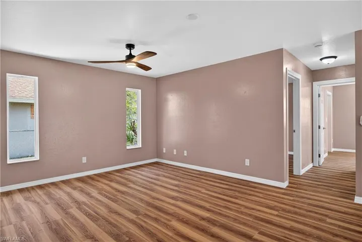 Back family room off kitchen.  View of hall to guest bedrooms and bath.