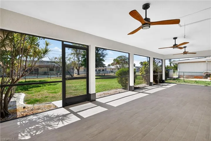 Screened in Lanai with 3 ceiling fans and pass thru window from kitchen