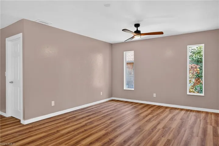 Primary bedroom with plenty of room for dresser/television