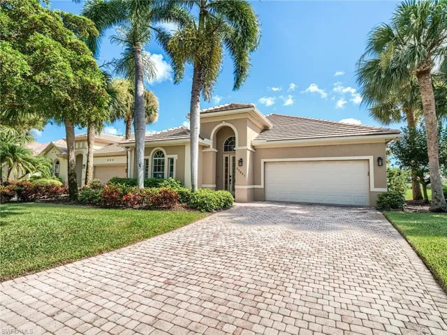 View of front of house featuring a 2-car garage on cul-de sac