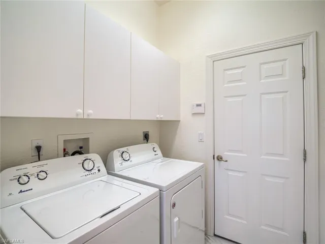 Clothes washing area with washing machine and clothes dryer and cabinets