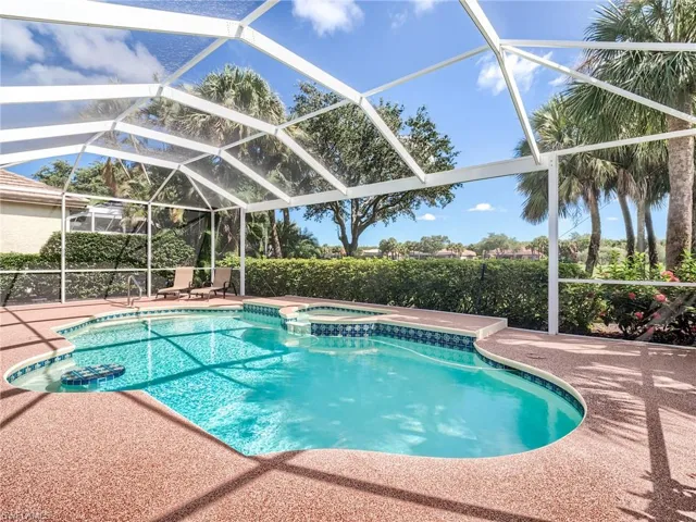 View of pool with an in ground hot tub