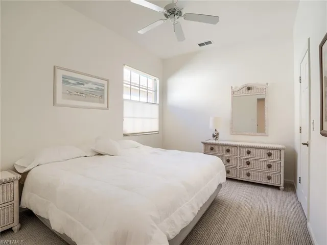 Carpeted bedroom #2 featuring ceiling fan