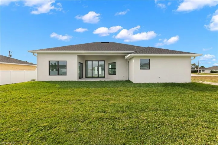Back of house featuring stucco siding and a patio area
