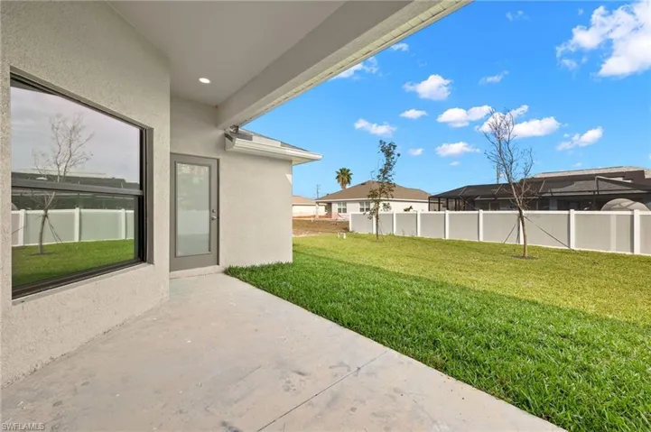 Fenced yard featuring a patio