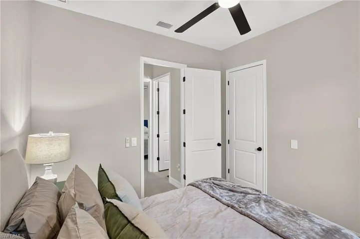 Recessed lighting, ceiling fan, and light gray walls
