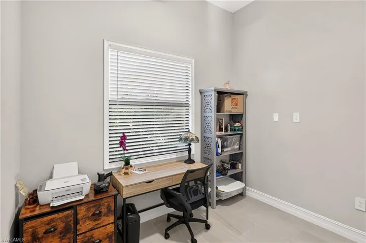 Light gray walls, white trim, and tiled flooring