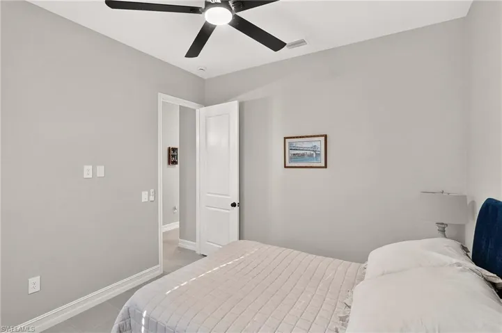 Recessed lighting, ceiling fan, solid core doors, and light gray wall paint