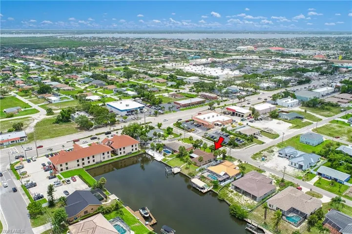 Aerial view of residential area with a nearby body of water