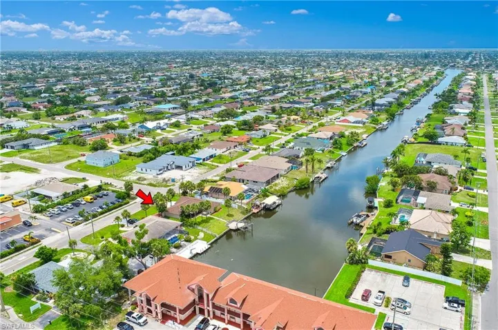 Aerial view of residential area featuring a large body of water